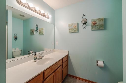 The full upper level bathroom has updated flooring.