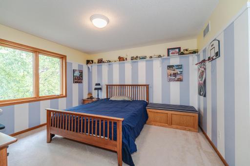 This is one of three upper level bedrooms.