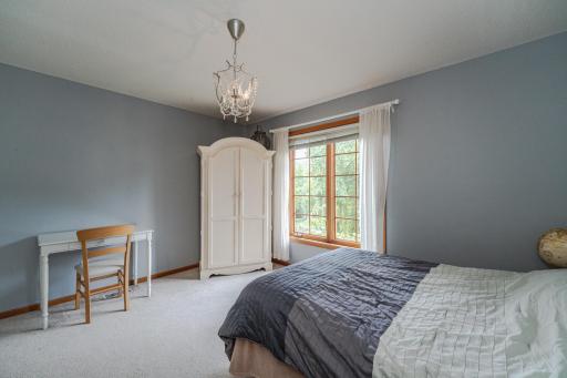 This is one of three upper level bedrooms.