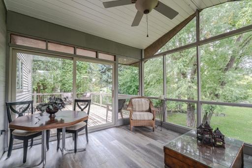 Beautiful backyard setting! The porch connects to a large wraparound deck.