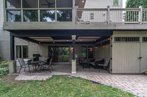 Underneath the 12' x 24' wraparound deck lies a paver patio and storage shed large enough to fit two snowmobiles.