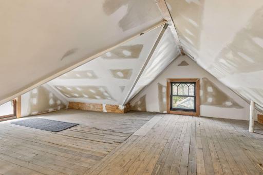 Attic insulated and drywalled. Perfect option for a studio or play space.