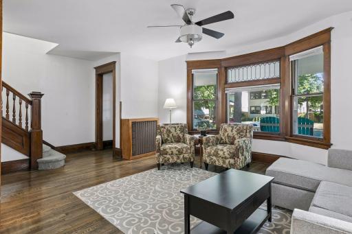 Beautiful near floor to ceiling bay window captures wonderful natural light.