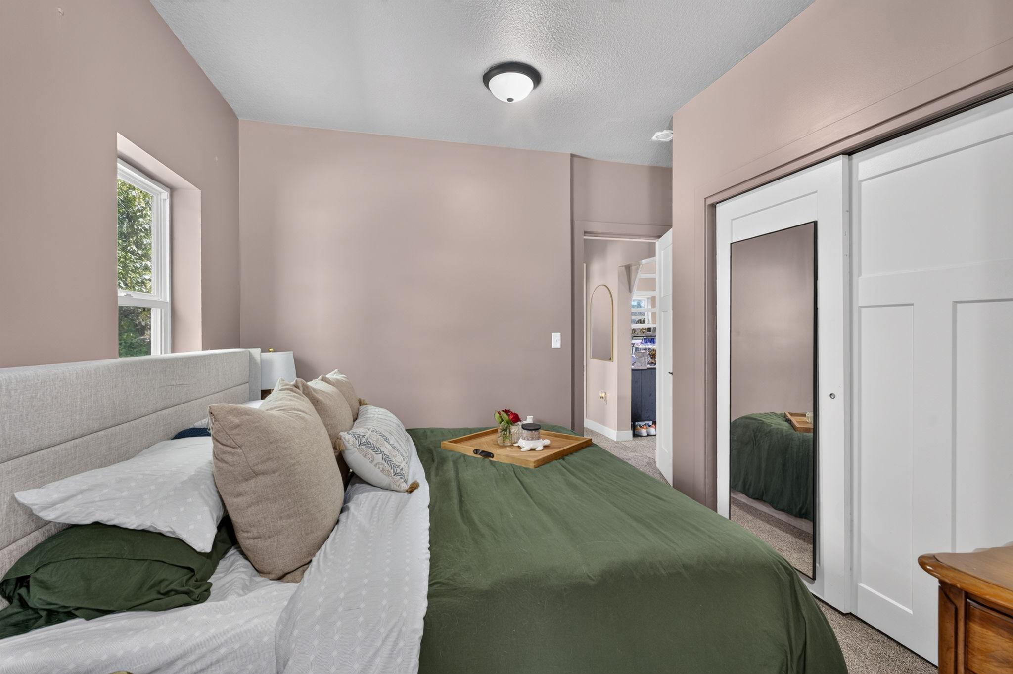 Comfortable primary bedroom offering a peaceful retreat at the end of the day.