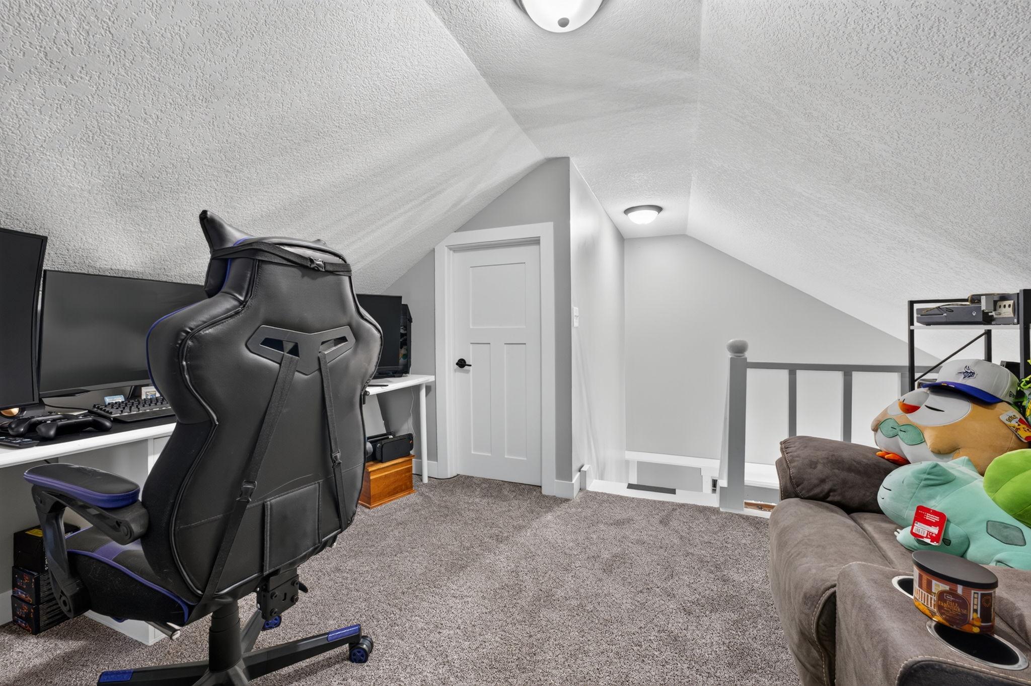 Loft above adds character and versatility, offering flexible space for a home office, hobbies, or a cozy retreat.