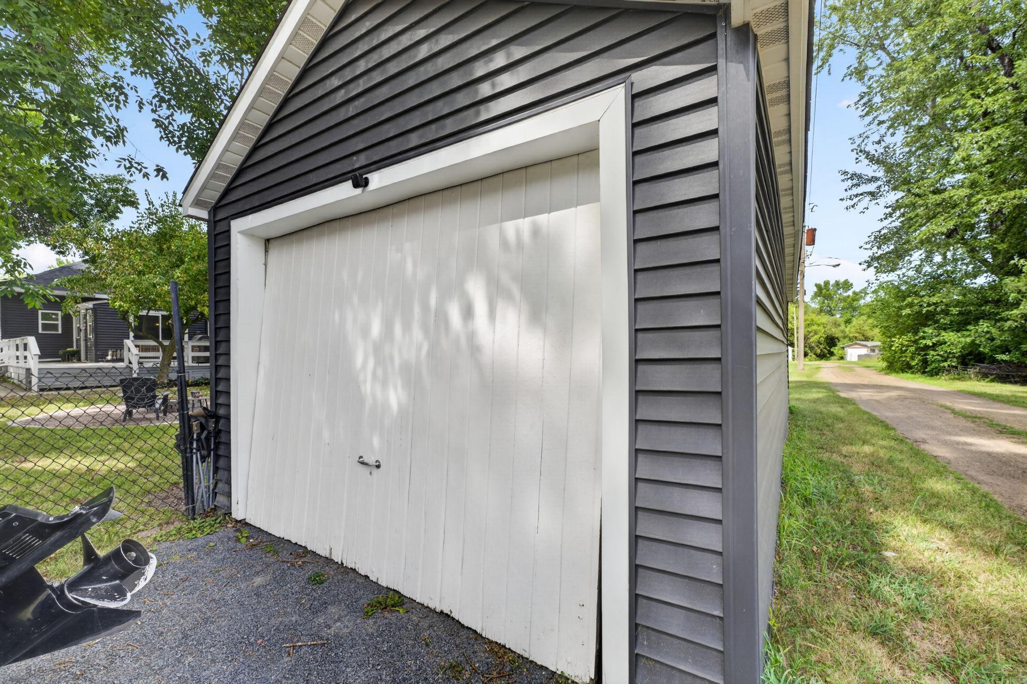 Detached garage offers a practical space for parking, storage, and weekend projects.