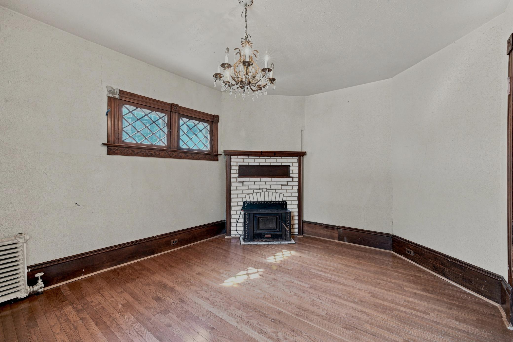 Fireplace feature, Chandelier, Transom window
