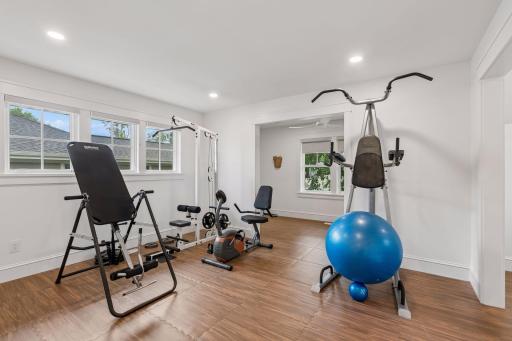 large upper level bunk room being used as an exercise room