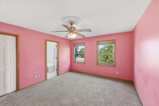 Primary bedroom with walk-in closet and private full bathroom.
