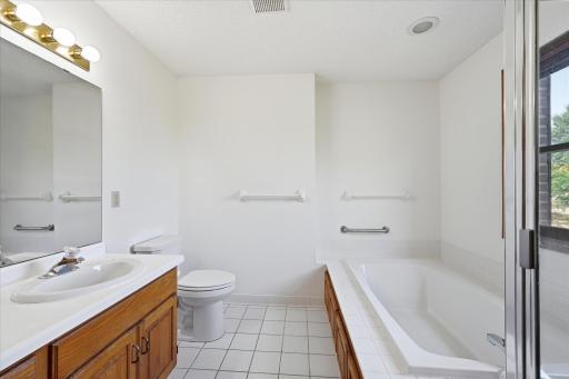 Primary bath with separate tub and shower.