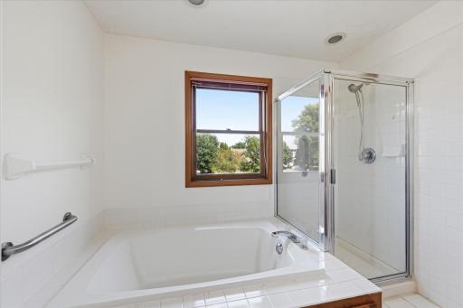 Primary bath with separate tub and shower.