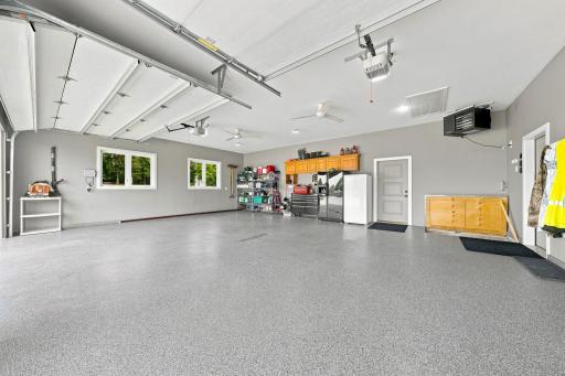 In Floor Heat (separate zone from house, but same boiler), Forced Air Heater,Floor Drain Trenched To Daylight,
Epoxy Floor,Pull Down Stairs, Ceiling Fans, 9 x 8 and 16 x 8 Steel Back Insulated Garage Doors, Underground Storm Shelter,Hot & Cold Faucet