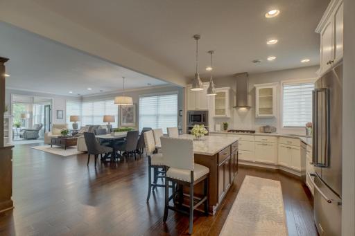 The kitchen flows naturally into the dining area and beautiful living room.