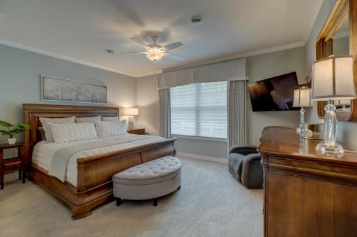 Retreat to the primary suite offering a generous walk-in closet and a spa-like bath with heated floors, dual vanities, a soaking tub, and a walk-in shower.