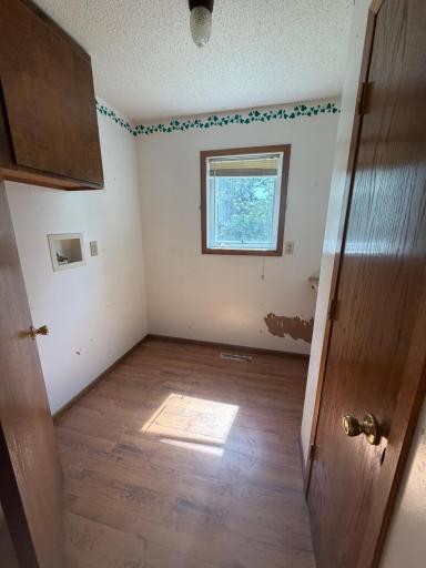 Main level, laundry hookups. Coat closet inside this room for convenience when coming in from the garage.