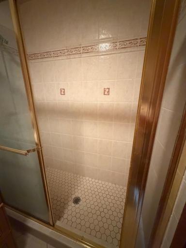 Walk in tiled shower.