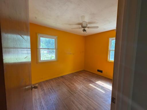 2nd Bedroom with exposed hardwood floors.