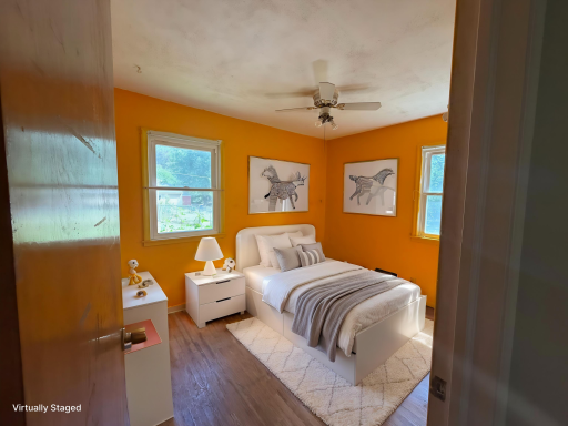 Virtually staged bedroom 2 on main floor.