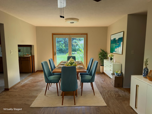 Virtually staged dining room walks out to the back yard.