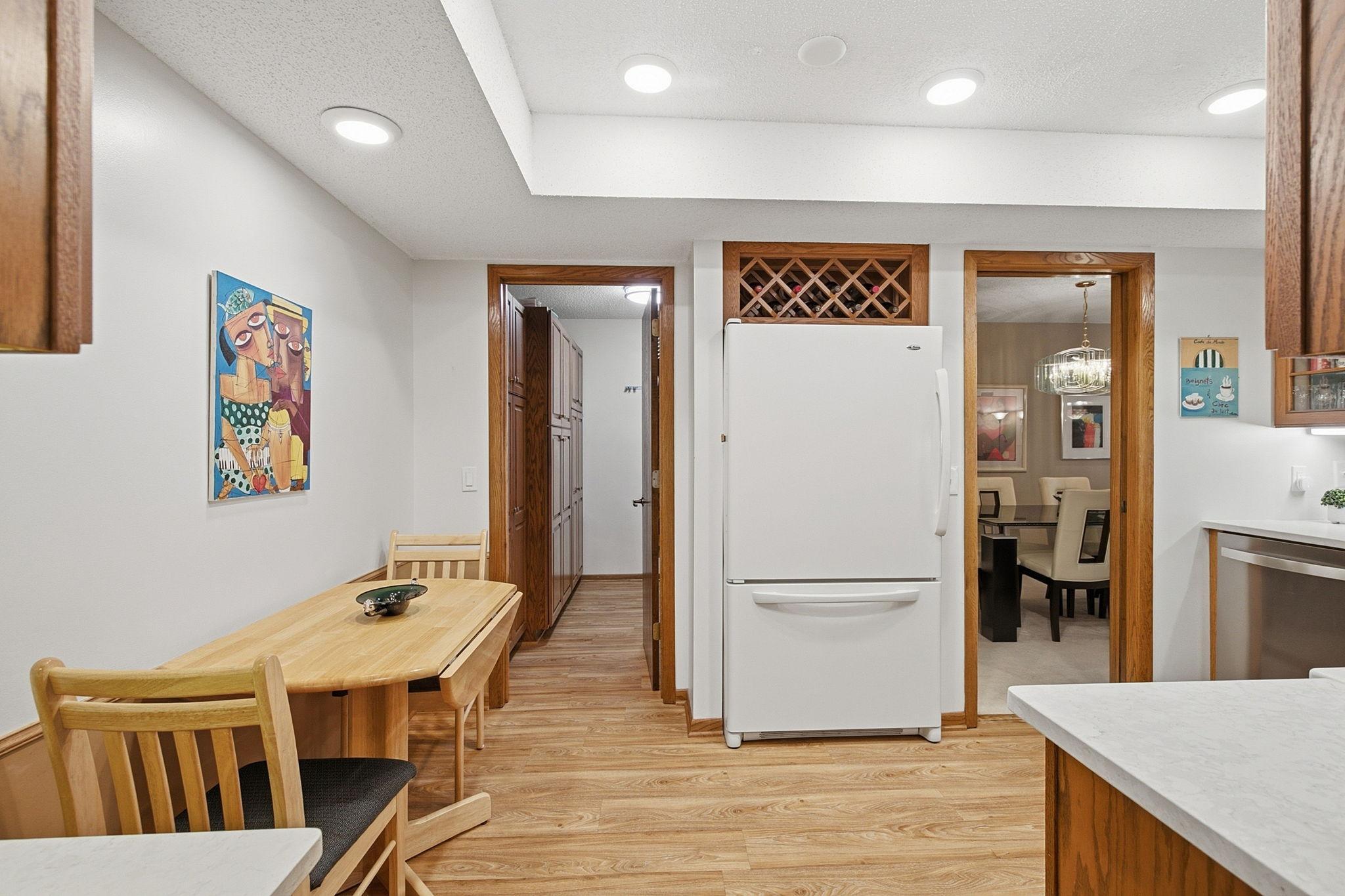 Kitchen & Breakfast Area - The kitchen offers abundant cabinetry and counter space along with a dedicated casual dining area and convenient access to the formal dining room.