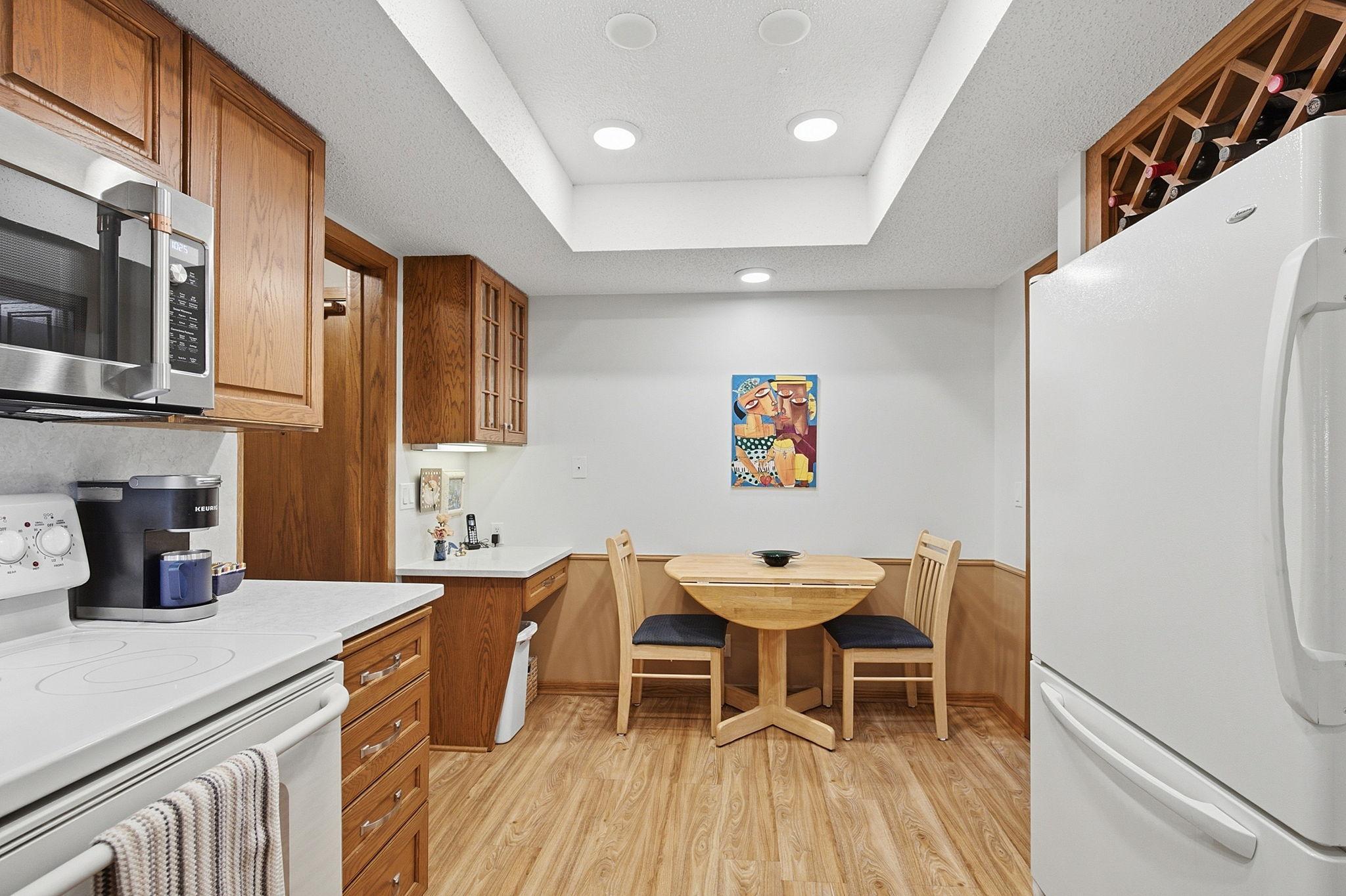 Breakfast Nook- A comfortable eat-in area extends the kitchen and provides a convenient spot for casual meals, with additional cabinetry and counter space nearby.