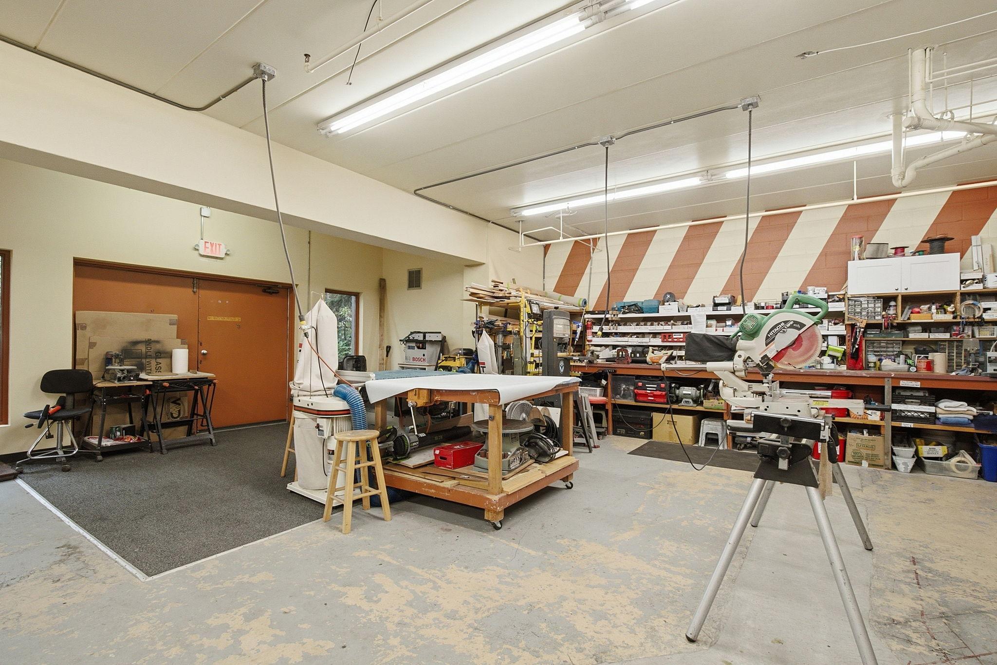Community Workshop - Dedicated resident workshop provides substantial workbench space and room for tools and projects—an uncommon and useful Laurel Hill community amenity.