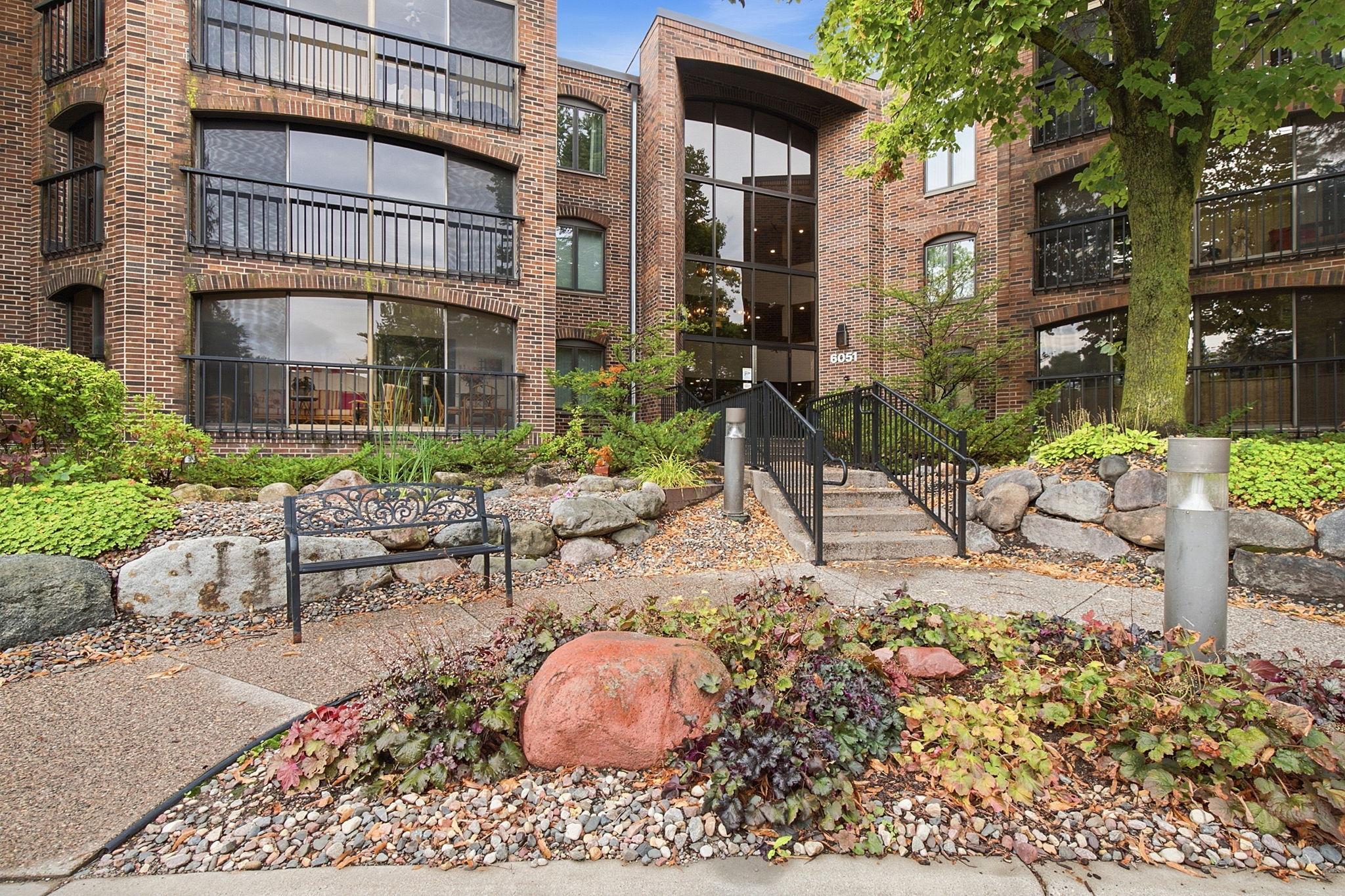 6051 Laurel Avenue - Attractive brick exterior, mature landscaping, and a welcoming entrance highlight the 6051 building at Laurel Hill West.