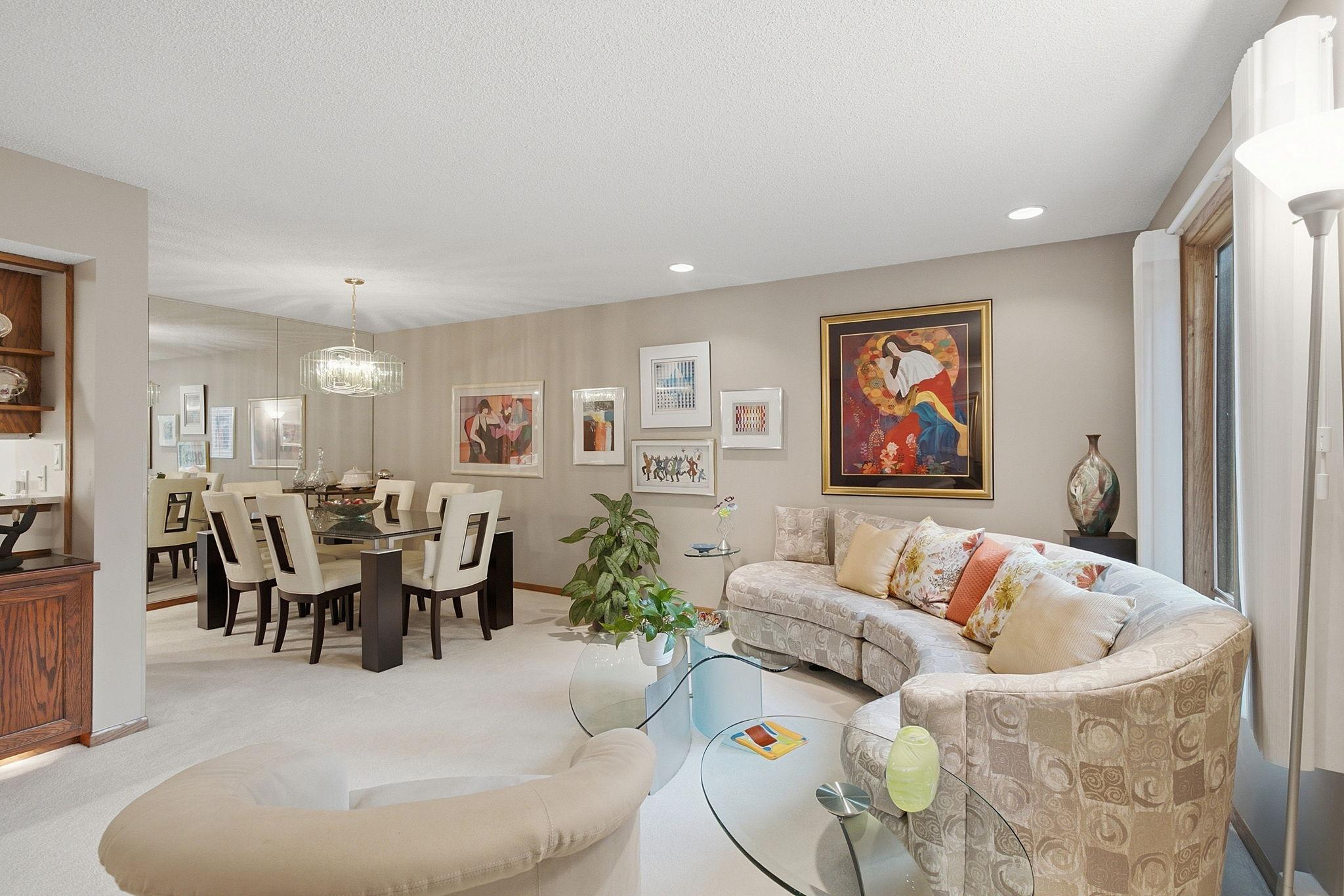 Living & Dining Area - Spacious living and dining area with large windows, abundant natural light, and an open layout offering flexibility for everyday living and entertaining.