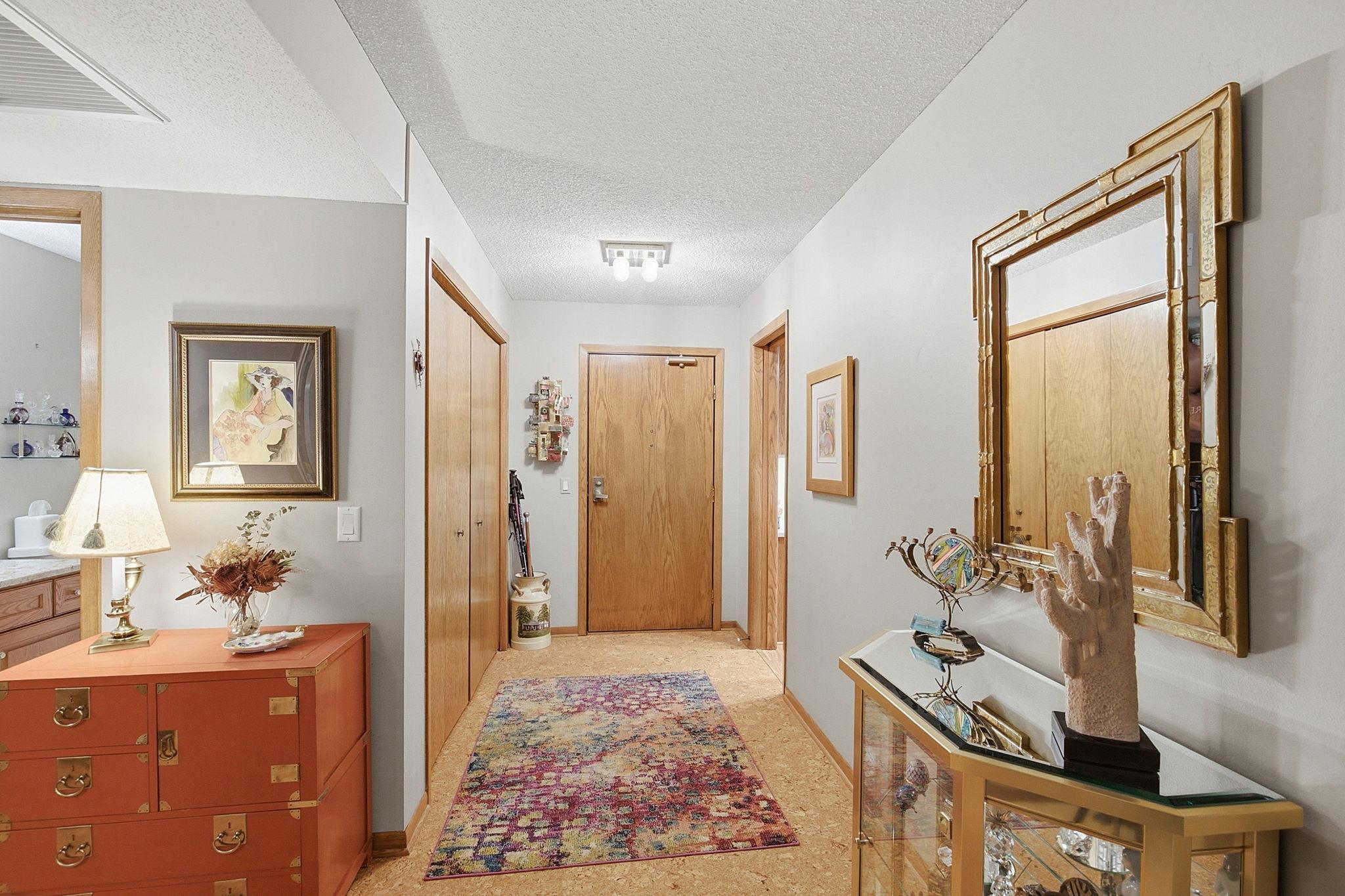 Entryway - Welcoming entry with warm wood trim, generous closet storage, and an open connection to the main living spaces.