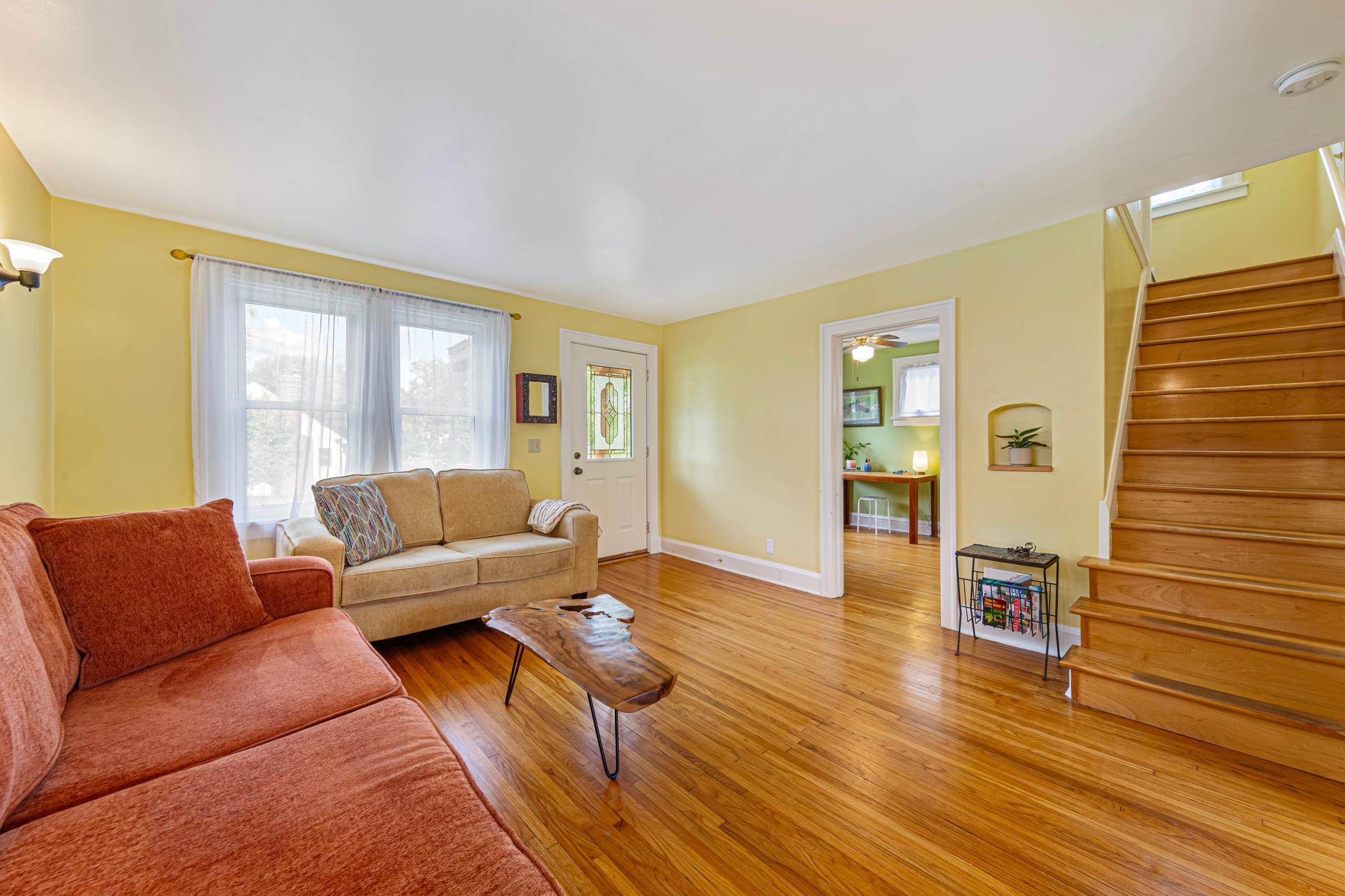 Warm and inviting living room flooded with natural light