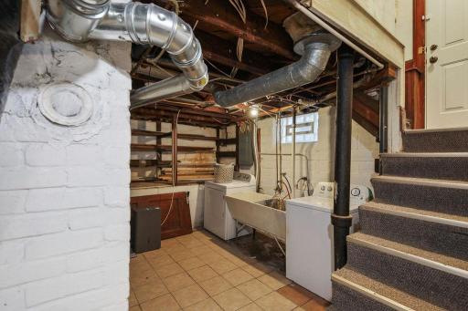 Lower laundry room with large wash sink
