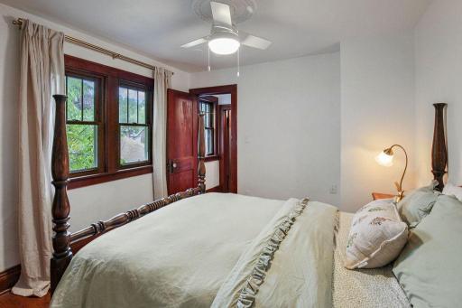 Double windows bring in natural light, while rich original trim continues the home's historic character.