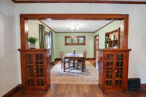 Check out the beautiful original built-ins frame the wide opening between the living and formal dining rooms!