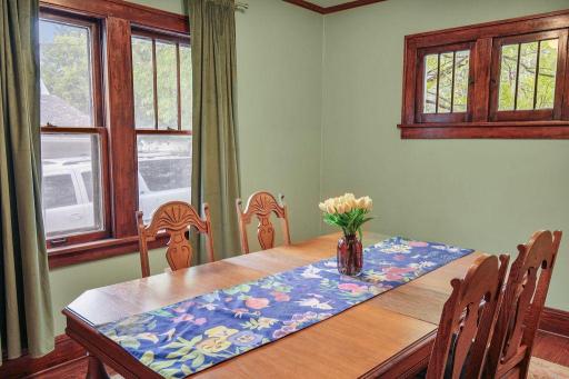Charming original windows and wood trim add architectural interest and warmth to the dining room.
