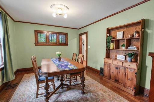 Formal dining room surrounded by rich original woodwork and filled with the character you just don’t find in newer homes.