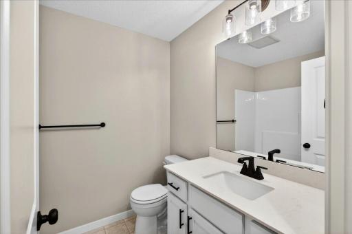 Main Bathroom. Photo taken of another home with similar plan and finishes.