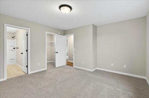 Primary Suite. Photo taken of another home with similar plan and finishes.