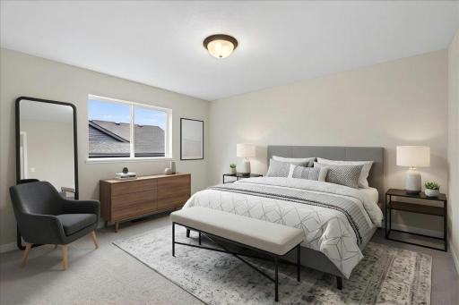 Primary Suite. Photo taken of another home with similar plan and finishes. Virtually Staged.