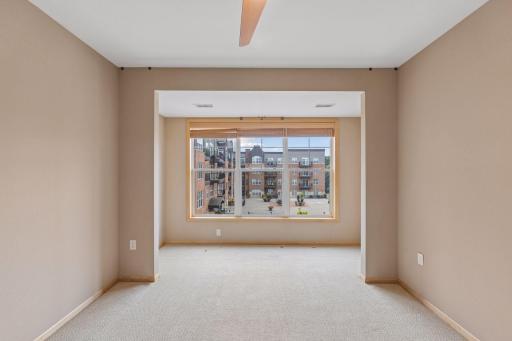 Owners suite -spacious, ceiling fan, private full bath and large walk-in closet