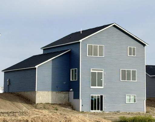 3117 Jandura Ave NE- Home features a walkout lower level to spacious backyard. Sod, Irrigation System, and Front Plantings will be installed soon.