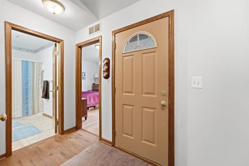 A cozy entryway welcomes you home with comfort and character.
