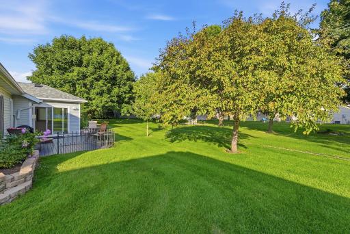 Well-maintained landscaping complements the home's exterior beautifully.