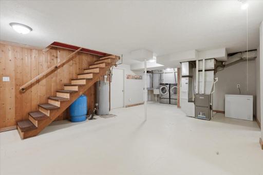 Spacious mudroom off the garage which includes laundry and utilities. Great space for storage, could be finished as a family room or could be a great space for a game room