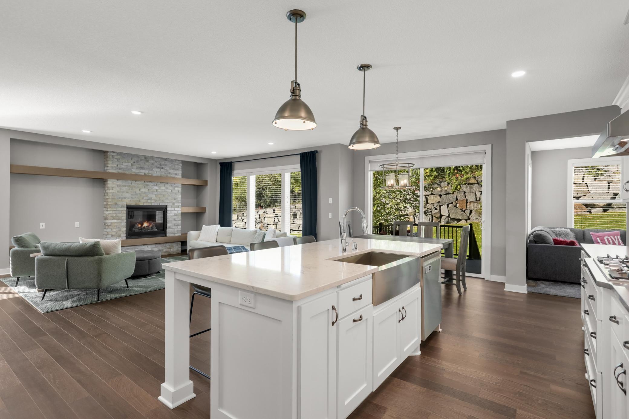 Open kitchen and dining area with direct access to the backyard deck.