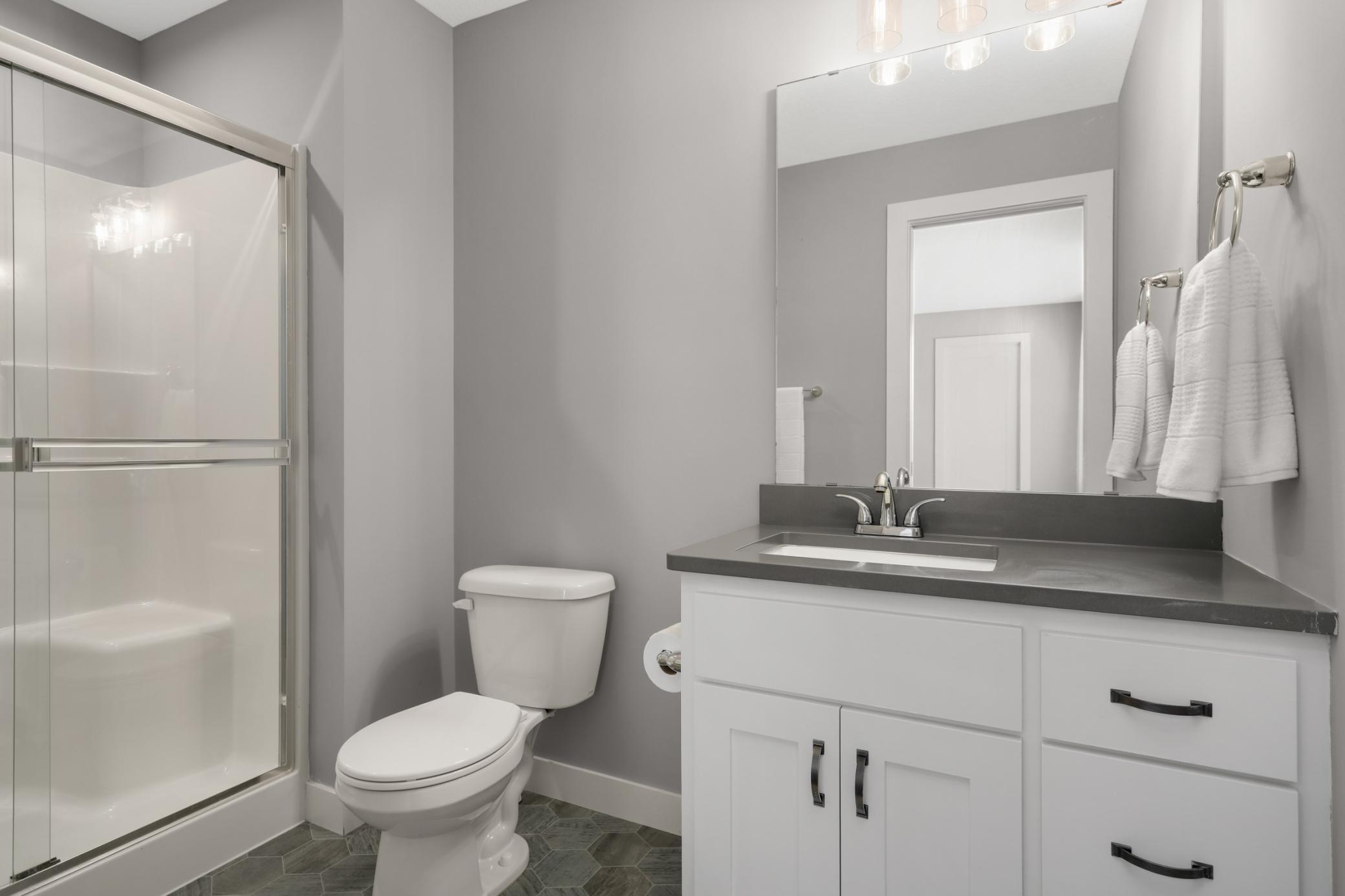 Secondary bedroom includes convenient direct access to an adjoining bathroom.