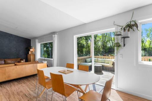 Glass doors off the dining area invite in even more sunshine and open directly to the oversized back deck, making indoor-to-outdoor living effortless.