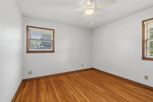 Bedroom #3 has ceiling fan/light and has windows on both sides of the wall as well (2nd window is partly shown in this picture).