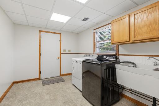 The laundry/mud room is very spacious and has a utility sink and plenty of storage.