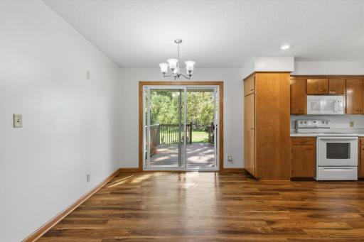 Open concept, view of the dining area from the living room. Dining has easy access to the deck with sliding glass doors.