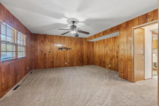 The Family Room in the Main Level with ceiling fan/light.